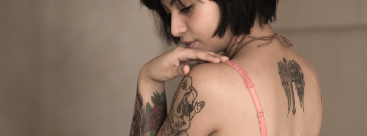 short haired girl with tattooes